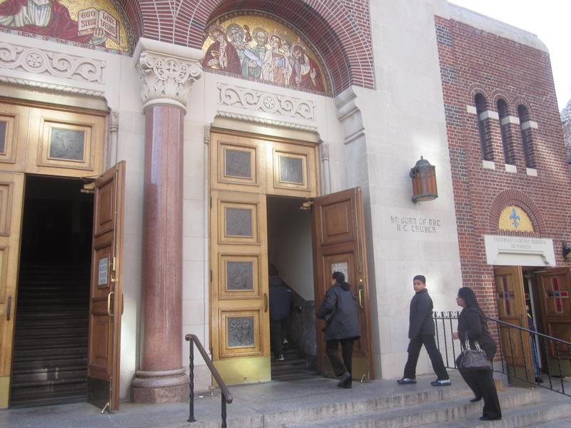 Worshipers enter St. Joan of Arc church